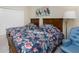 Guest bedroom with two twin beds and floral bedding at 10820 Trophy Dr, Englewood, FL 34223