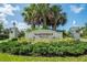 Martinique community entrance sign with lush landscaping at 10820 Trophy Dr, Englewood, FL 34223