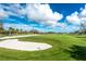 Landscaped golf course with sand traps at 10820 Trophy Dr, Englewood, FL 34223