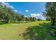 Landscaped golf course with paved pathway at 10820 Trophy Dr, Englewood, FL 34223