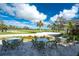 Outdoor patio seating overlooking golf course at 10820 Trophy Dr, Englewood, FL 34223