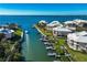 Aerial view of a tranquil waterfront community with boats and lush greenery at 11000 Placida Rd # 201, Placida, FL 33946