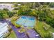 Aerial view of community pickleball courts nestled in lush landscaping at 11000 Placida Rd # 201, Placida, FL 33946