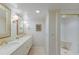 Elegant bathroom with double vanity, walk-in shower, and updated fixtures at 11000 Placida Rd # 201, Placida, FL 33946