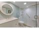 Updated bathroom with white tile, walk-in shower and large vanity at 11000 Placida Rd # 201, Placida, FL 33946