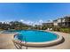 Enjoy this circular community pool with plenty of lounging space at 11000 Placida Rd # 201, Placida, FL 33946