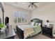 Charming bedroom with double bed, window shutters, and dark wood furniture at 117 Cable Dr, Rotonda West, FL 33947