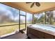 Enclosed hot tub with screened enclosure and backyard view at 117 Cable Dr, Rotonda West, FL 33947