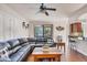 Relaxing living room with sectional sofa, coffee table, and wood floors at 117 Cable Dr, Rotonda West, FL 33947