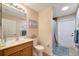 Simple bathroom with single vanity, toilet and shower at 13235 Essman Ave, Port Charlotte, FL 33953