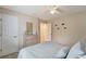 Bedroom with a queen bed, ceiling fan, and ample closet space at 13235 Essman Ave, Port Charlotte, FL 33953