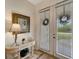 Bright and airy entryway with glass-top console table at 13235 Essman Ave, Port Charlotte, FL 33953