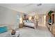 Main bedroom with king-size bed and access to bathroom at 13235 Essman Ave, Port Charlotte, FL 33953