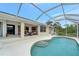 Inviting pool and patio with covered lanai at 13235 Essman Ave, Port Charlotte, FL 33953