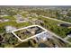 Wide aerial view of property showing home and surrounding lots at 13575 Chenille Dr, Port Charlotte, FL 33981