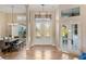 Elegant entryway with double doors and a view of the living room at 13575 Chenille Dr, Port Charlotte, FL 33981