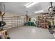 Garage with overhead door, storage shelves, and extra space at 13575 Chenille Dr, Port Charlotte, FL 33981