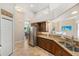 Kitchen with stainless steel fridge and double sink at 13575 Chenille Dr, Port Charlotte, FL 33981