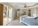 Main bedroom with sliding glass doors to exterior and sitting area at 13575 Chenille Dr, Port Charlotte, FL 33981