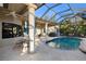 Relaxing pool and patio area with covered lanai and seating at 13575 Chenille Dr, Port Charlotte, FL 33981