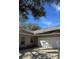 Attached garage with white door and neutral exterior at 1415 Winding Oak Dr, Port Charlotte, FL 33948