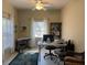 Bright home office features a work desk, comfortable seating, and ample natural light at 1415 Winding Oak Dr, Port Charlotte, FL 33948