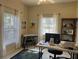 Home office with built-in shelving and a large desk at 1415 Winding Oak Dr, Port Charlotte, FL 33948