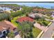 Houses with red tile roofs near the waterfront, showing lush landscaping at 14173 Myakka Pointe Dr, Port Charlotte, FL 33953