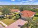 Two houses with red tile roofs, brick driveways, and tropical landscaping at 14173 Myakka Pointe Dr, Port Charlotte, FL 33953