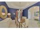 Formal dining room with dark wood table and blue walls at 14173 Myakka Pointe Dr, Port Charlotte, FL 33953