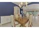 Formal dining room with dark wood table and blue walls at 14173 Myakka Pointe Dr, Port Charlotte, FL 33953