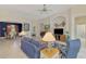 Bright living room features a comfortable sofa and access to adjacent dining area at 14173 Myakka Pointe Dr, Port Charlotte, FL 33953