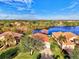 Community of homes near a lake, showcasing waterfront property at 14394 Silver Lakes Cir, Port Charlotte, FL 33953