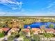 Wide shot of houses near a lake, showcasing a neighborhood at 14394 Silver Lakes Cir, Port Charlotte, FL 33953