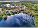 Aerial view showcasing a community by the lake at 14394 Silver Lakes Cir, Port Charlotte, FL 33953