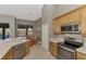 Kitchen with stainless steel appliances and an adjacent breakfast nook at 14394 Silver Lakes Cir, Port Charlotte, FL 33953