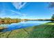 Serene lake view from the backyard at 14394 Silver Lakes Cir, Port Charlotte, FL 33953