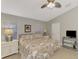 Main bedroom featuring a king bed, ceiling fan, and plenty of natural light at 14394 Silver Lakes Cir, Port Charlotte, FL 33953