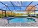 Enclosed pool and spa with a view of the lake at 14394 Silver Lakes Cir, Port Charlotte, FL 33953