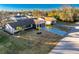 Aerial view of single Gathering home with landscaping and palm trees at 1505 Fireside St, Port Charlotte, FL 33952