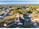 Aerial view of a single-Gathering home with solar panels and a large backyard at 1505 Fireside St, Port Charlotte, FL 33952