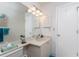 Bright bathroom featuring a vanity and large mirror at 1505 Fireside St, Port Charlotte, FL 33952