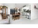 Dining room with wooden table and view into the kitchen at 1505 Fireside St, Port Charlotte, FL 33952