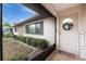 Inviting front entrance with a screened porch and wreath at 1505 Fireside St, Port Charlotte, FL 33952