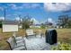 Backyard patio with seating and grill at 1505 Fireside St, Port Charlotte, FL 33952