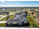 Aerial view of a single-Gathering home with pool and large backyard in a residential neighborhood at 152 Sportsman Rd, Rotonda West, FL 33947