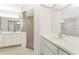 Bathroom with double sinks, a shower, and white cabinets at 152 Sportsman Rd, Rotonda West, FL 33947