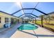 Inviting screened pool and patio with ample space for relaxation and entertaining at 152 Sportsman Rd, Rotonda West, FL 33947