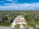 Aerial view of house, pool, and surrounding lot at 1600 Thomas St, Englewood, FL 34223