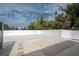 Landscaped backyard with gravel and white fence at 1600 Thomas St, Englewood, FL 34223